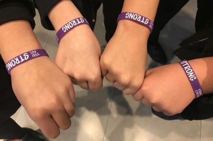 Young Carers standing together with their strong wrist bands